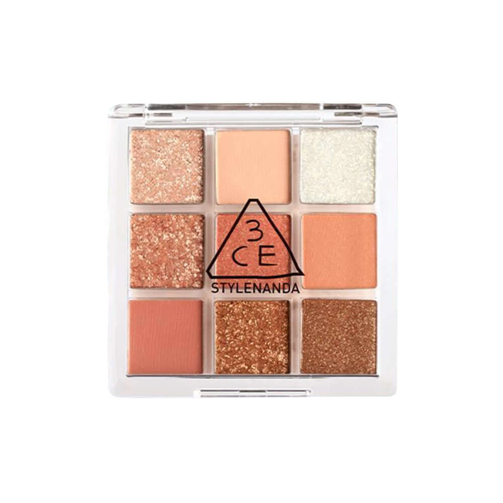 3CE Multi Eye Color Palette #Shot Again featuring 9 warm orange-coral shades and glitters for vibrant eye looks.